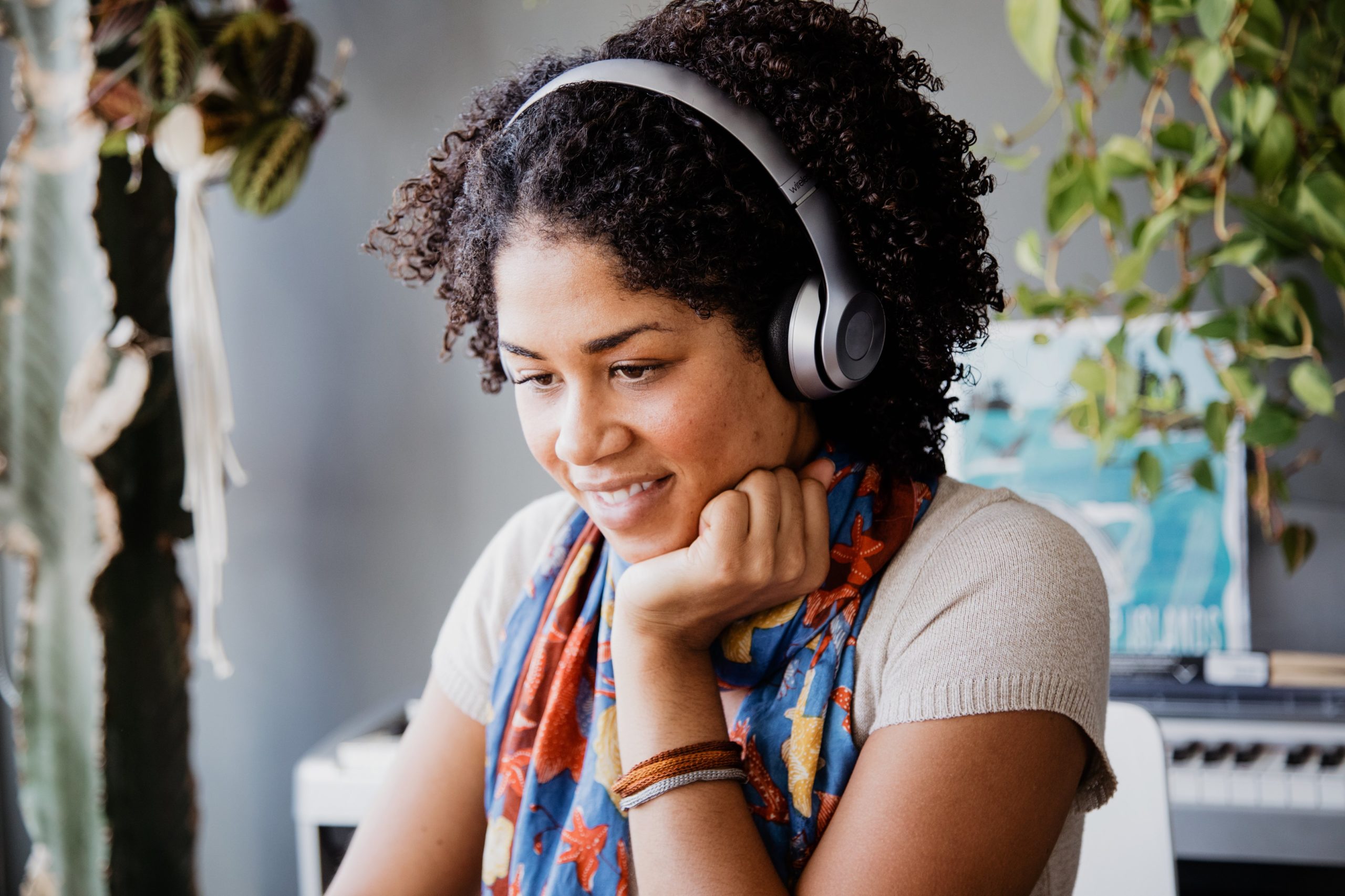 Woman Using Headphones - AudioFetch - Audio Over WiFi Streaming