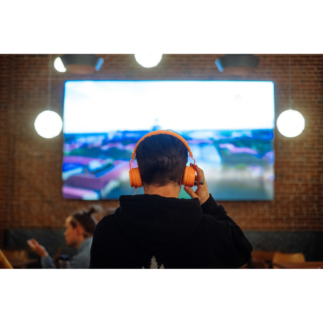 Man Using AudioFetch at Sports Bar